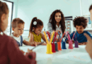 Children and teacher doing crafts at a table