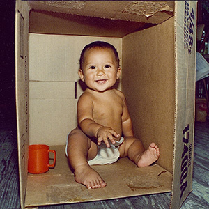 boy playing in a box