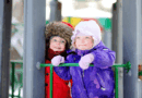 Children playing on the playground in the winter