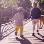 children walking on bridge