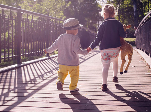 children walking on bridge
