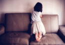 Child on the couch facing the wall