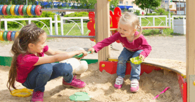 Children fighting in a sand box