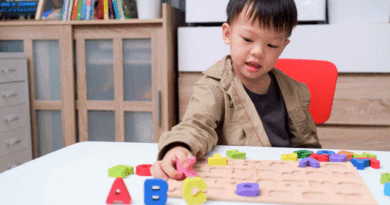 Child playing with letter blocks