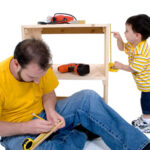 dad and son working with tools
