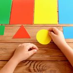 child sorting shapes