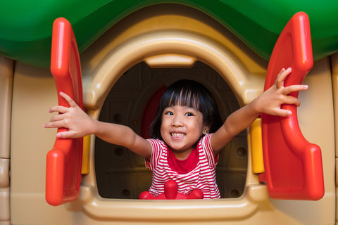 child in playhouse