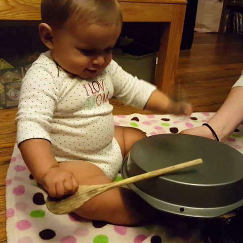 child using a drum