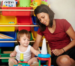 adult and child in playroom