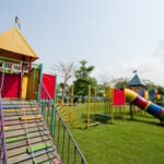 colorful outdoor playground with climbing equipment and slide