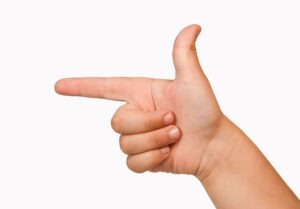 child pointing finger with thumb up